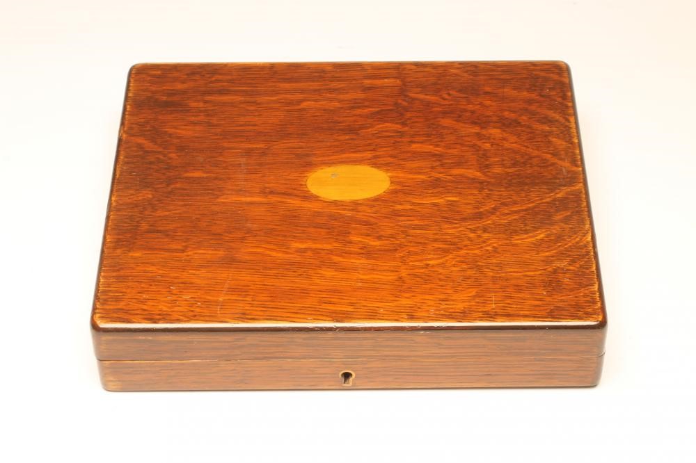 A SET OF TWELVE PAIRS OF SILVER DESSERT KNIVES AND FORKS Image