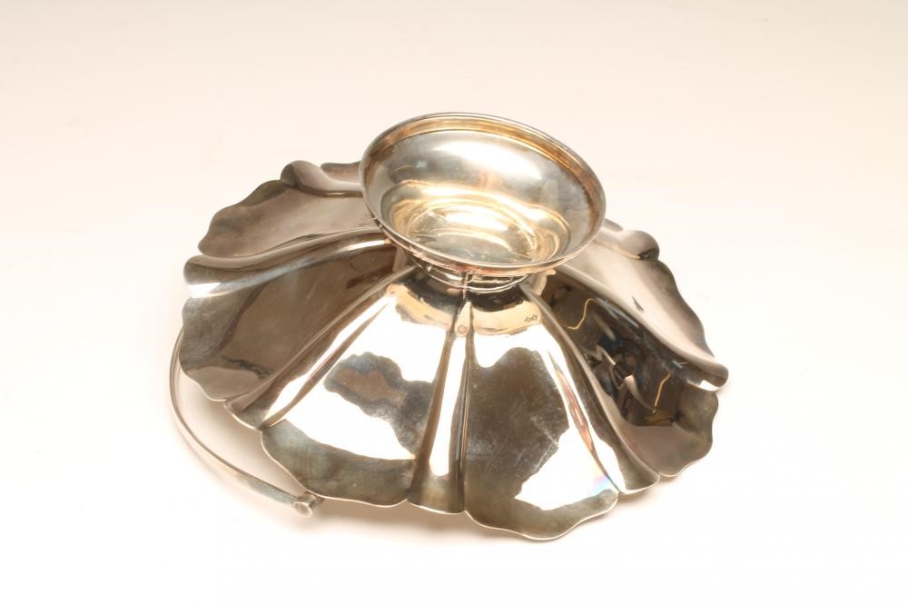 A SILVER CAKE BASKET Image