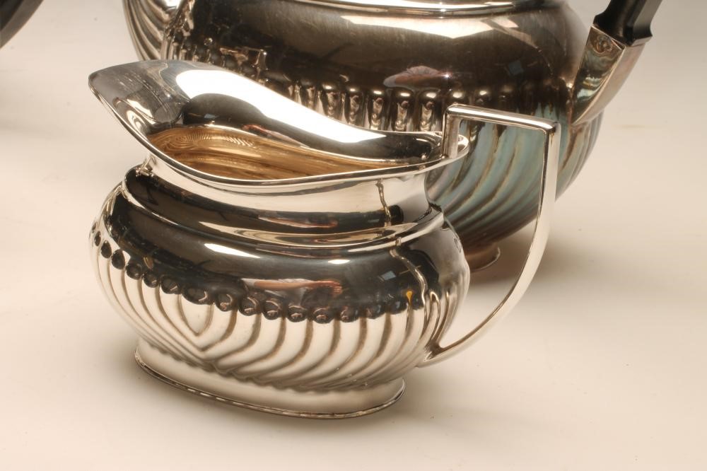 *A SILVER FOUR PIECE TEA AND COFFEE SERVICE Image