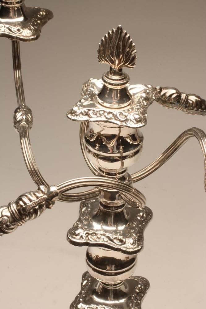 A SILVER FOUR BRANCH FIVE LIGHT CANDELABRUM Image