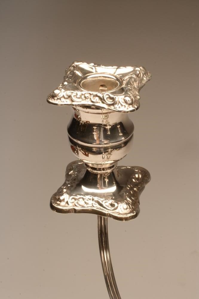 A SILVER FOUR BRANCH FIVE LIGHT CANDELABRUM Image