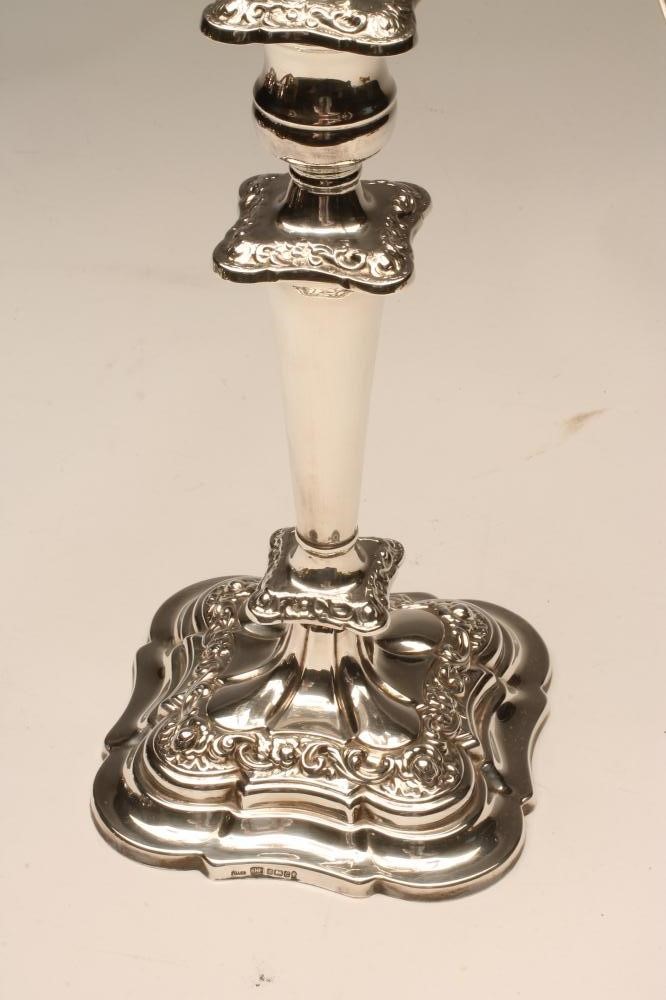 A SILVER FOUR BRANCH FIVE LIGHT CANDELABRUM Image