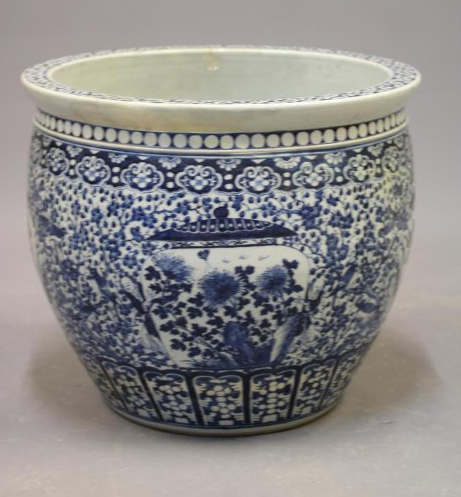 A LARGE CHINESE PORCELAIN JARDINIERE of baluster form painted in underglaze blue with panels of Image