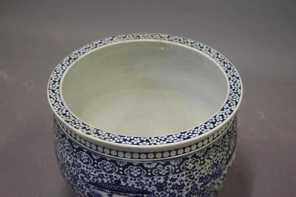 A LARGE CHINESE PORCELAIN JARDINIERE of baluster form painted in underglaze blue with panels of Image