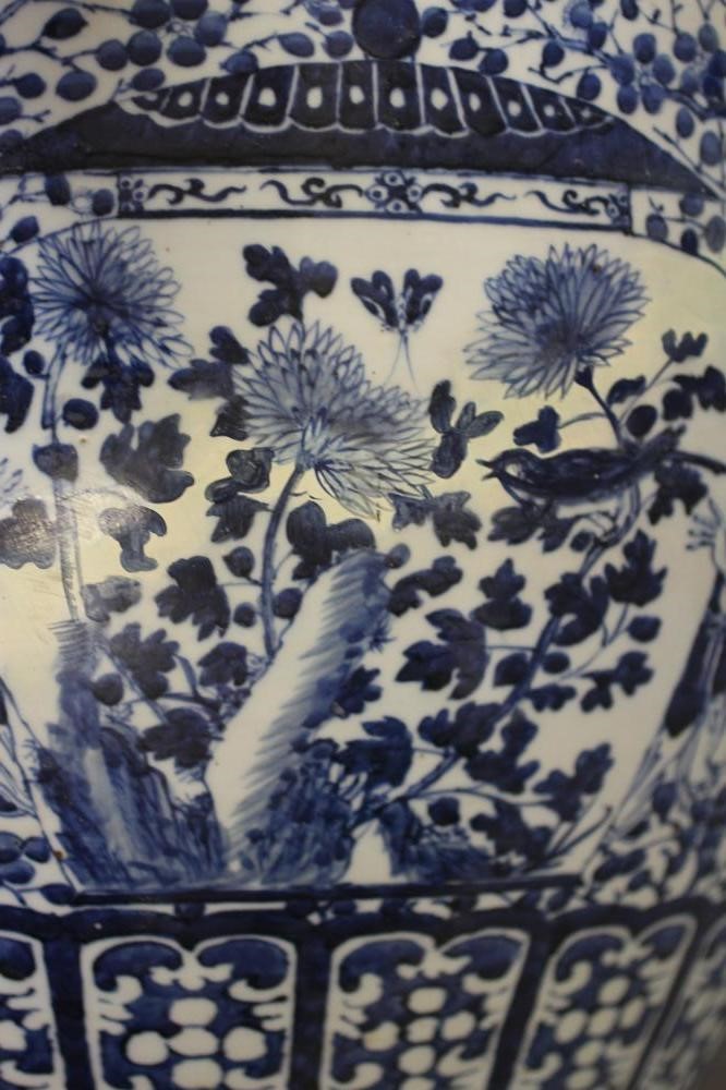 A LARGE CHINESE PORCELAIN JARDINIERE of baluster form painted in underglaze blue with panels of Image