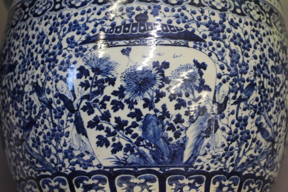 A LARGE CHINESE PORCELAIN JARDINIERE of baluster form painted in underglaze blue with panels of Image