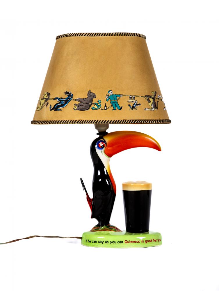 A CARLTONWARE GUINNESS TOUCAN LAMP BASE, mid 20th century, with original parchment type novelty Image