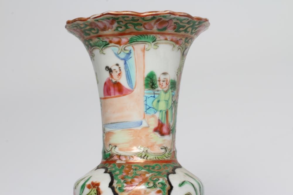 A CANTONESE PORCELAIN FAMILLE ROSE SMALL GU VASE painted with panels of figures, flowers and birds Image