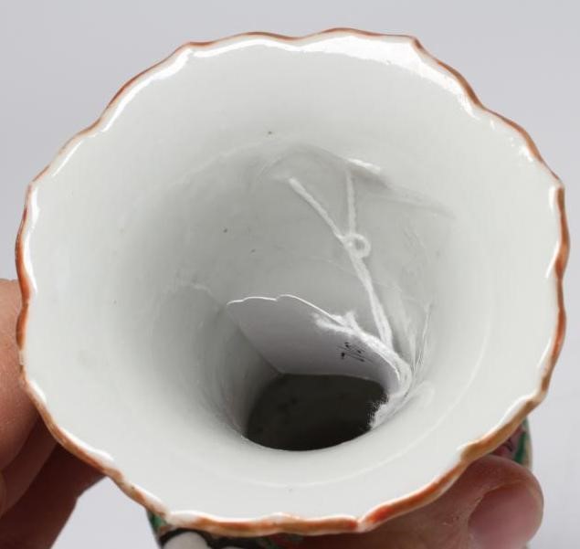 A CANTONESE PORCELAIN FAMILLE ROSE SMALL GU VASE painted with panels of figures, flowers and birds Image