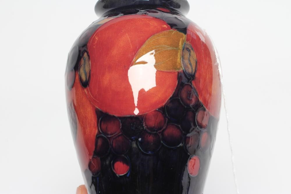 A MOORCROFT POTTERY POMEGRANATE VASE, 1928-1949, of inverted baluster form, painted in typical Image