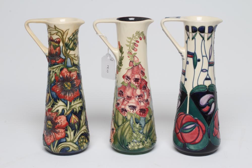 THREE MOORCROFT POTTERY EWERS Image