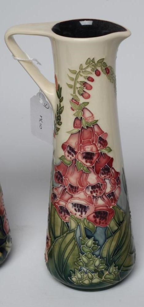 THREE MOORCROFT POTTERY EWERS Image