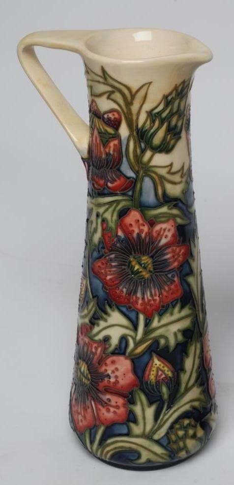 THREE MOORCROFT POTTERY EWERS Image