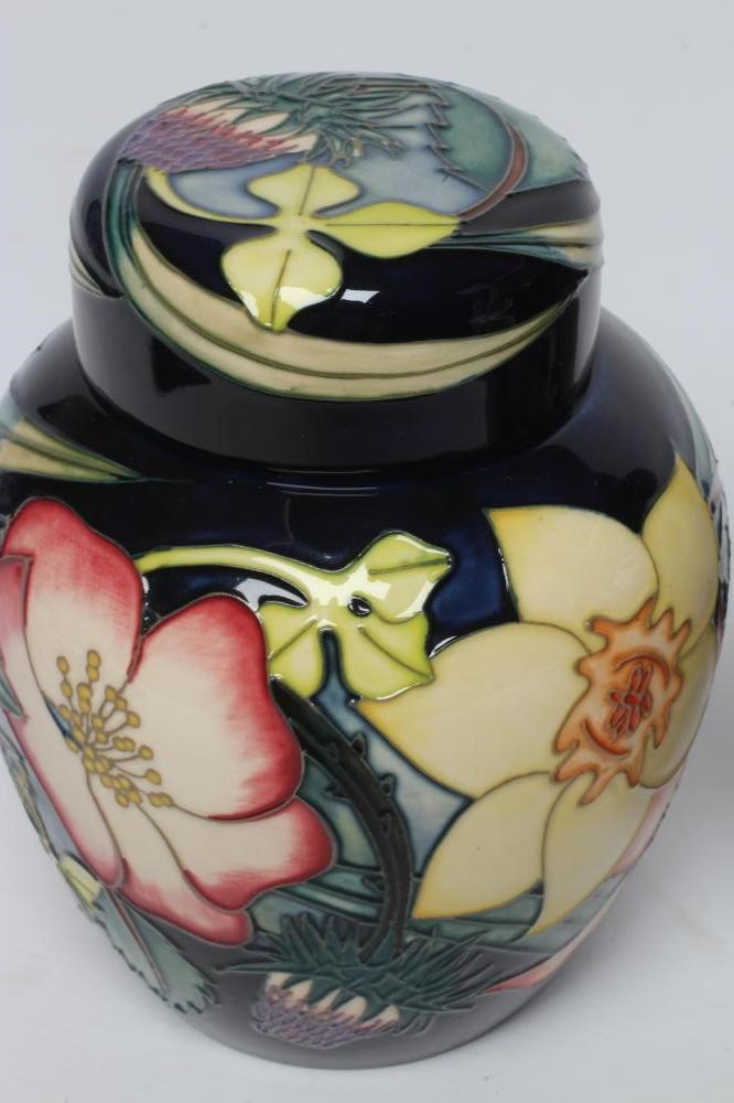 TWO MOORCROFT POTTERY JARS AND COVERS Image