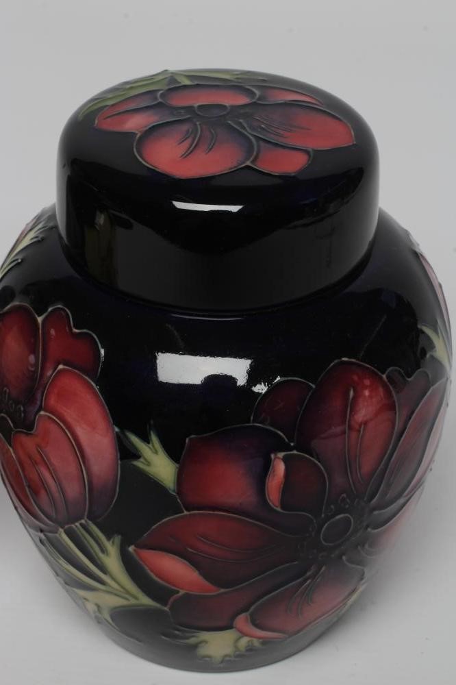 TWO MOORCROFT POTTERY JARS AND COVERS Image