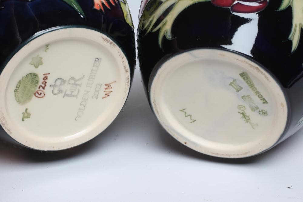 TWO MOORCROFT POTTERY JARS AND COVERS Image