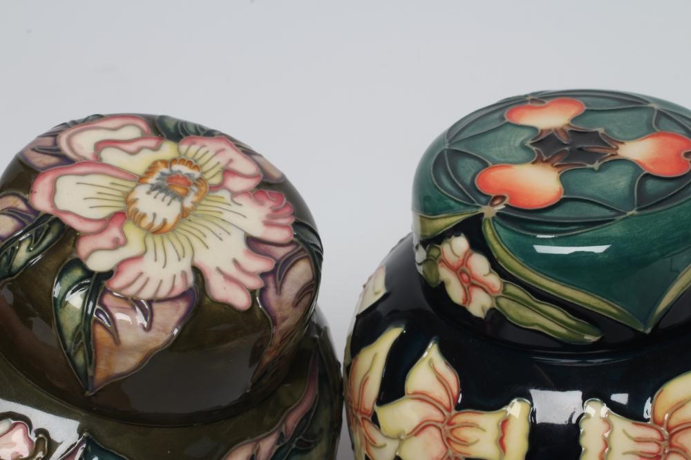TWO MOORCROFT POTTERY JARS AND COVERS Image