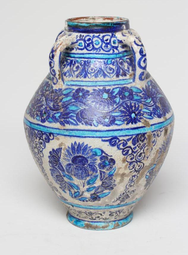 AN INDIAN MULTAN TIN GLAZED EARTHENWARE JAR of conical form with four loop handles Image