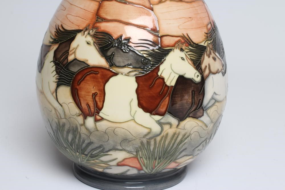 A MOORCROFT POTTERY STAMPEDE TRIAL VASE, 2005, of baluster form, painted in colours designed by Paul Image