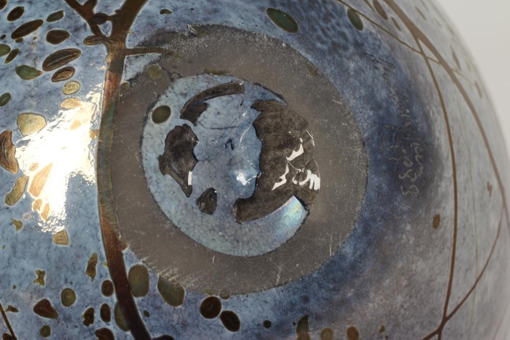 PETER LAYTON (b.1937), a studio bowl of globular form, blown iridescent glass, signed to the based Image