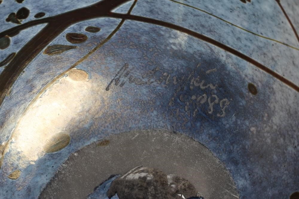 PETER LAYTON (b.1937), a studio bowl of globular form, blown iridescent glass, signed to the based Image