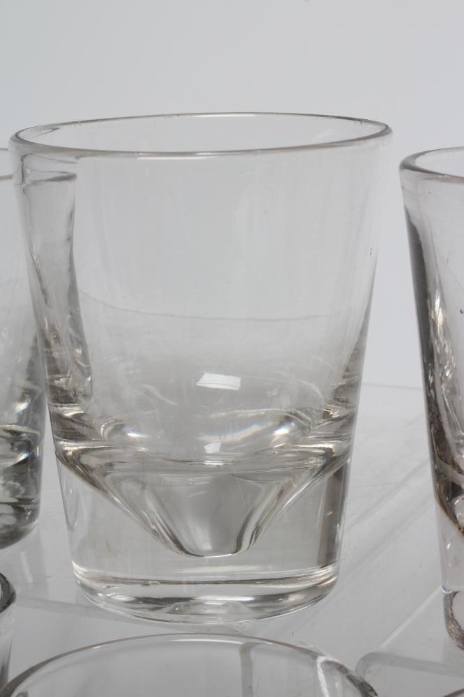A COLLECTION OF TWENTY FIVE GEORGIAN AND LATER HEAVY GLASS TUMBLERS, various sizes and dates (Est. Image