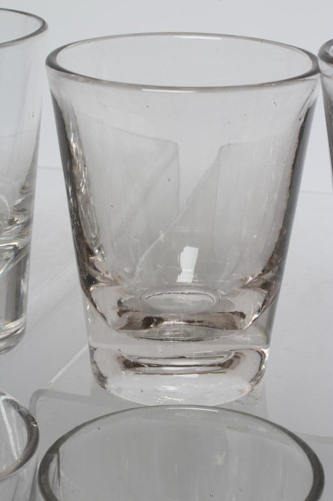 A COLLECTION OF TWENTY FIVE GEORGIAN AND LATER HEAVY GLASS TUMBLERS, various sizes and dates (Est. Image