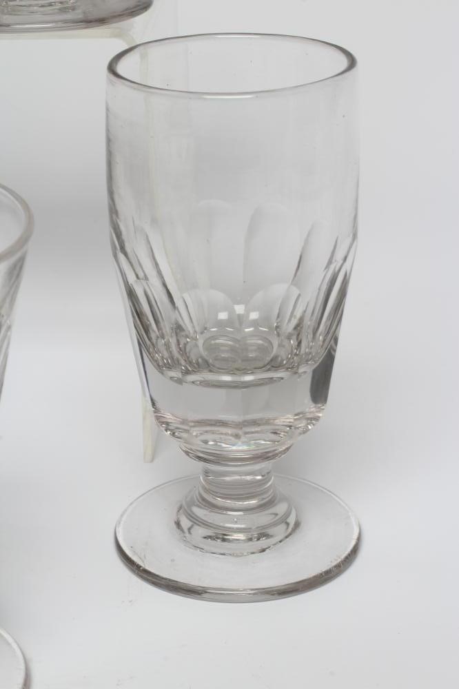 A MATCHED SET OF SEVEN GLASS RUMMERS with panel cut bucket bowls, together with a set of four other Image