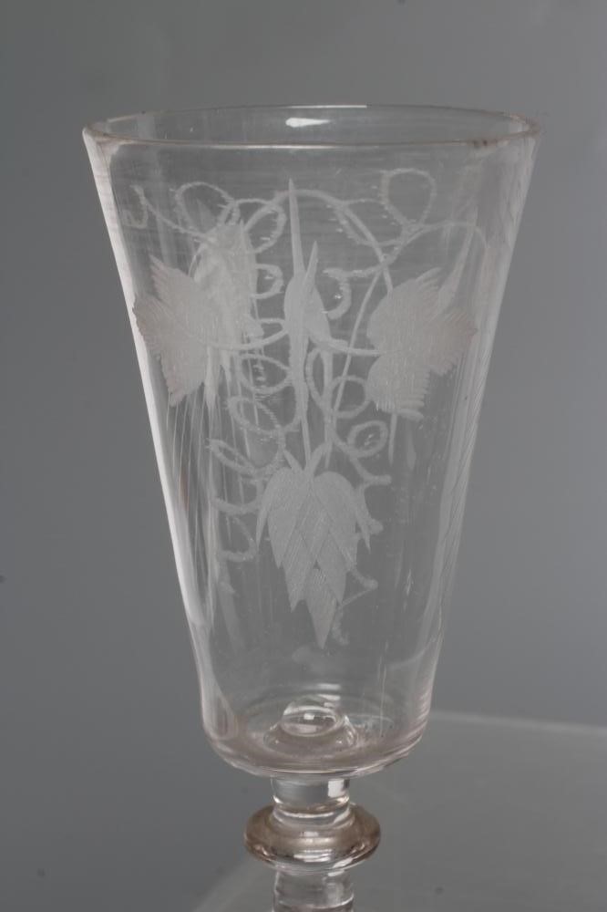 A COLLECTION OF SEVEN GLASS FLUTES Image