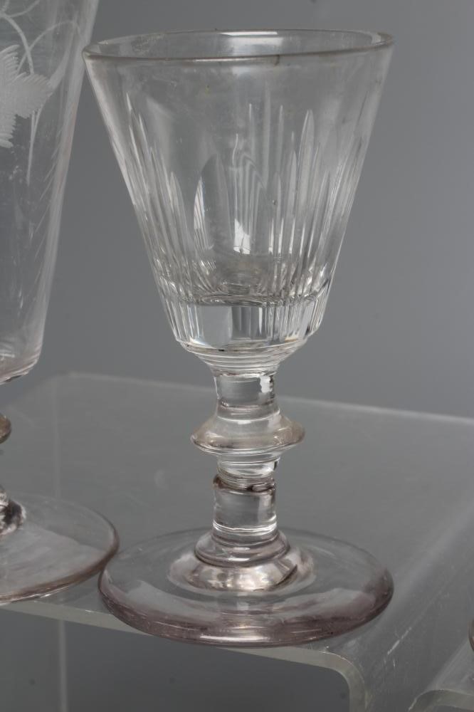 A COLLECTION OF SEVEN GLASS FLUTES Image