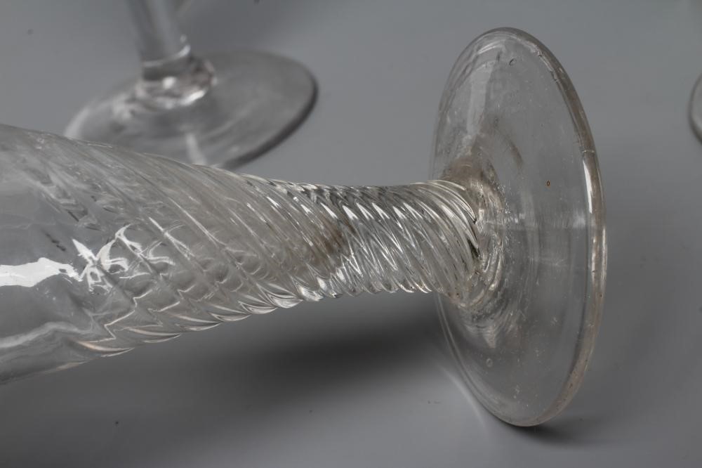 A COLLECTION OF SEVEN GLASS FLUTES Image