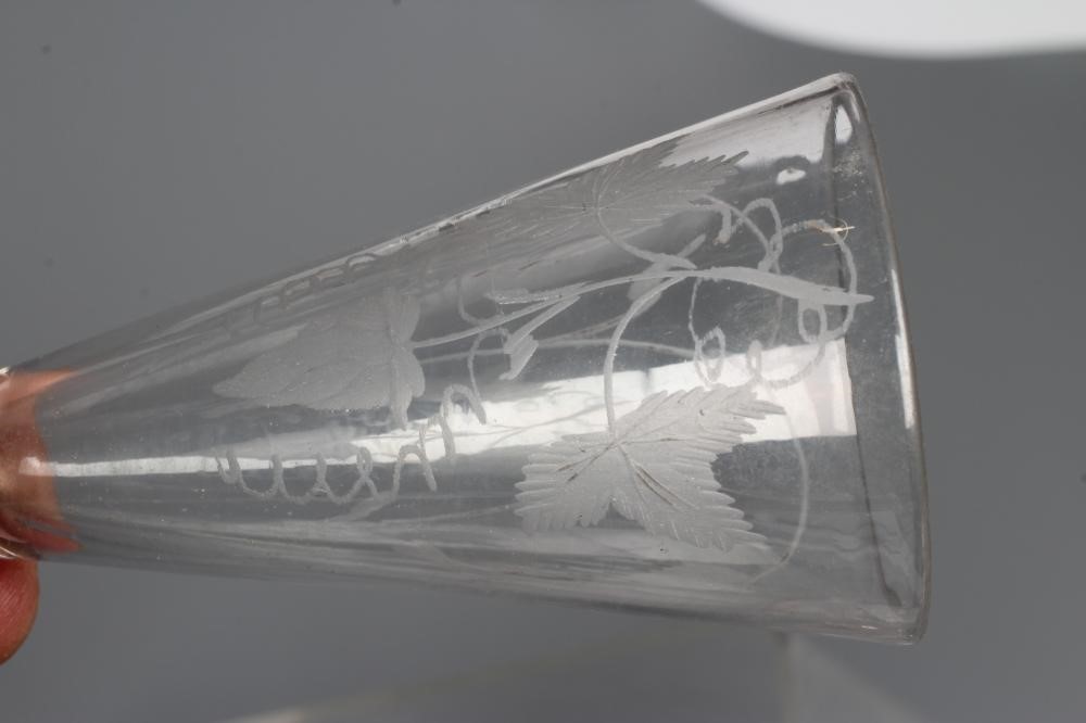 A COLLECTION OF SEVEN GLASS FLUTES Image