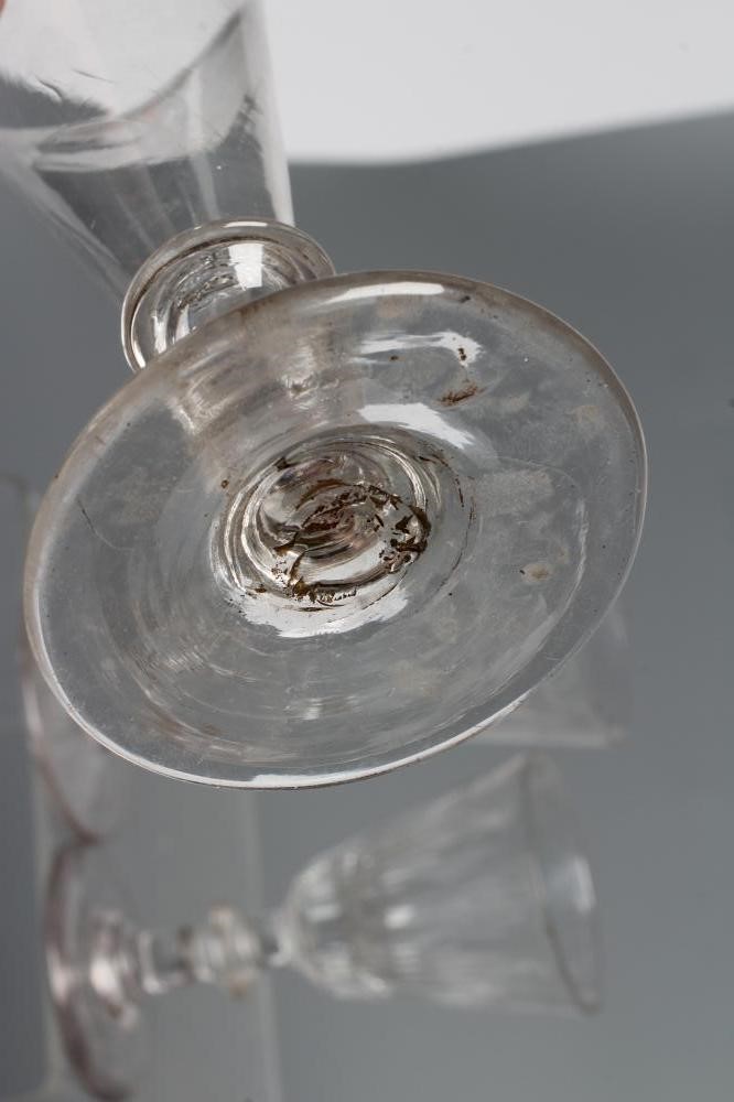 A COLLECTION OF SEVEN GLASS FLUTES Image