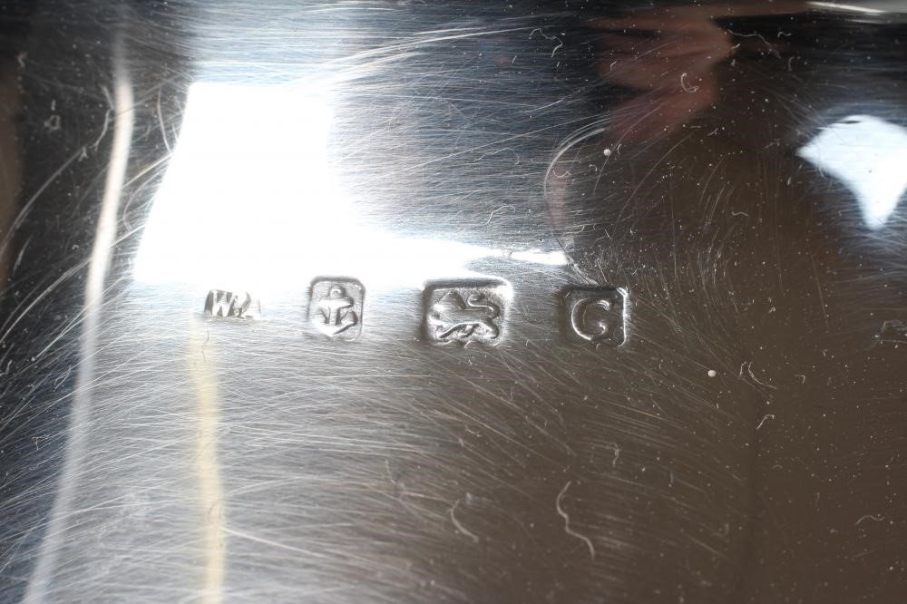 A SILVER THREE PIECE TEA SERVICE Image