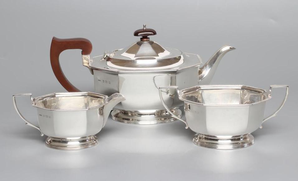 A SILVER THREE PIECE TEA SERVICE Image