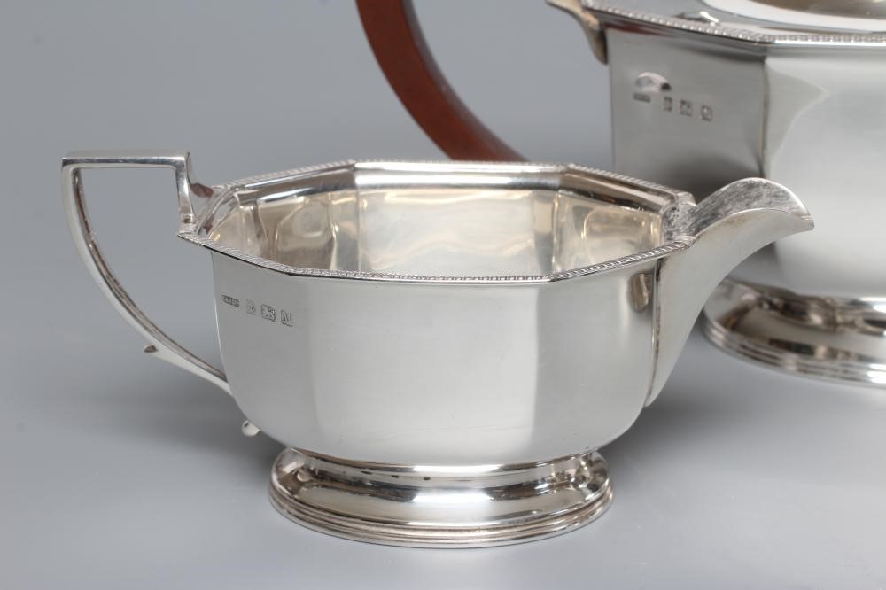 A SILVER THREE PIECE TEA SERVICE Image