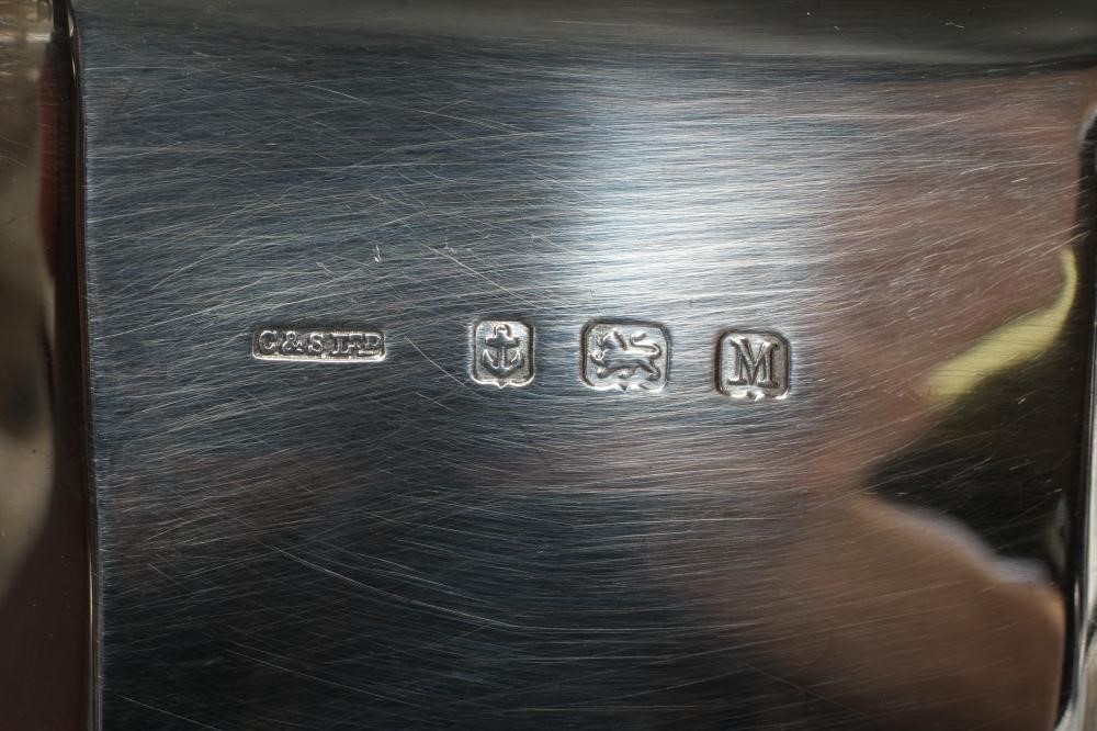 A SILVER THREE PIECE TEA SERVICE Image