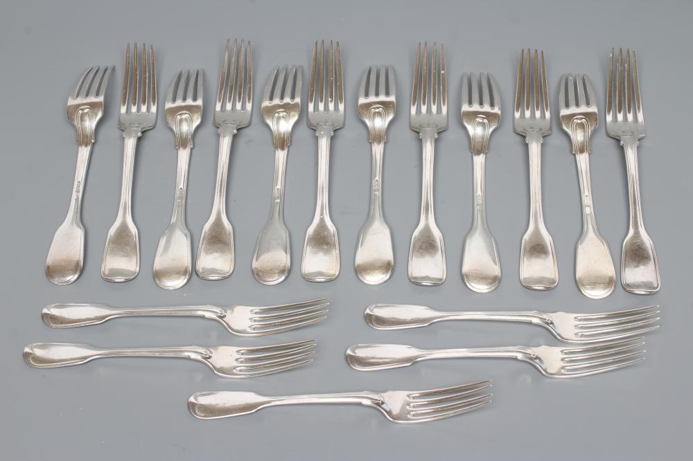 A SET OF TWELVE SILVER TABLE FORKS Image