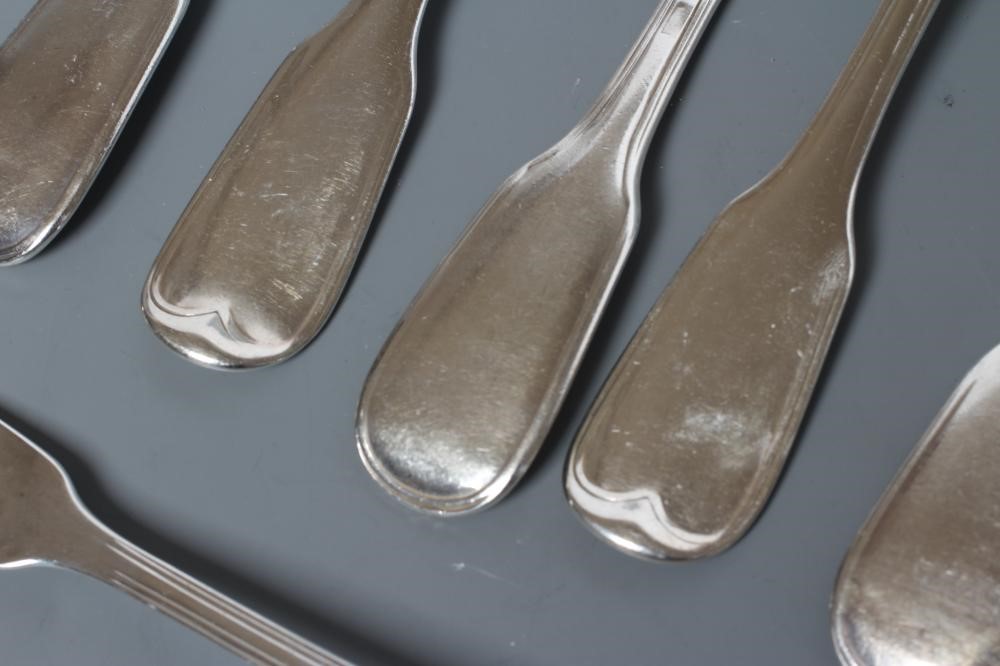 A SET OF TWELVE SILVER TABLE FORKS Image