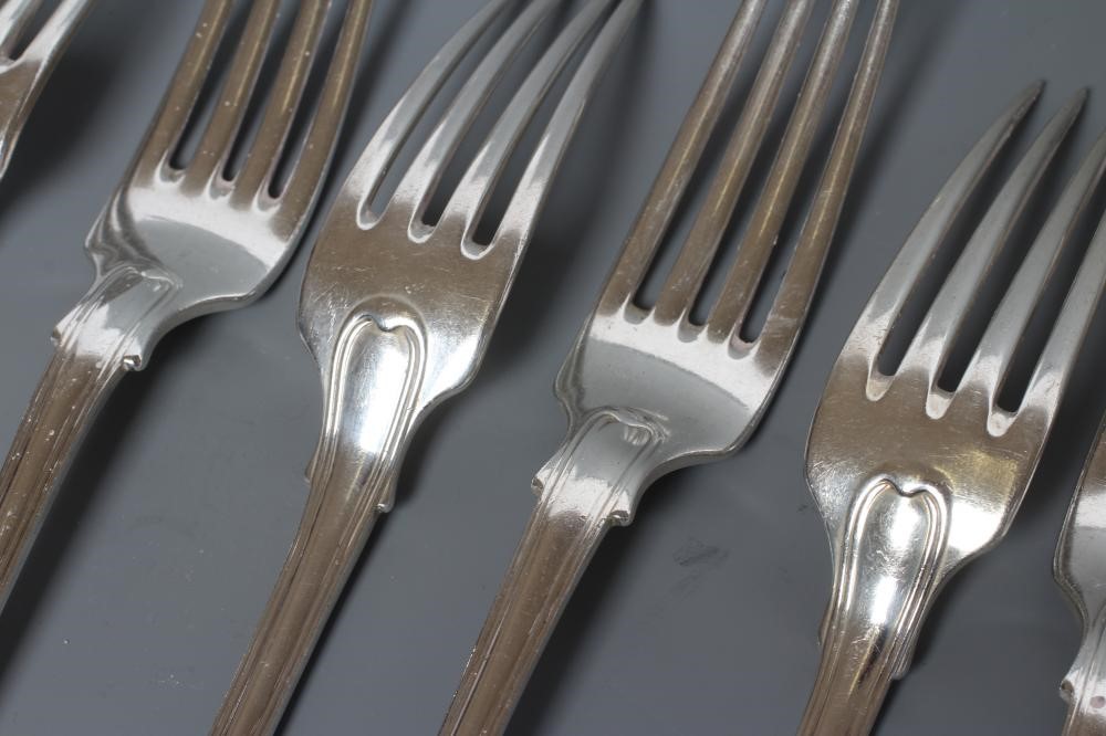 A SET OF TWELVE SILVER TABLE FORKS Image