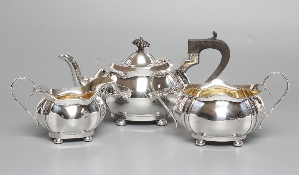 A SILVER THREE PIECE TEA SERVICE Image