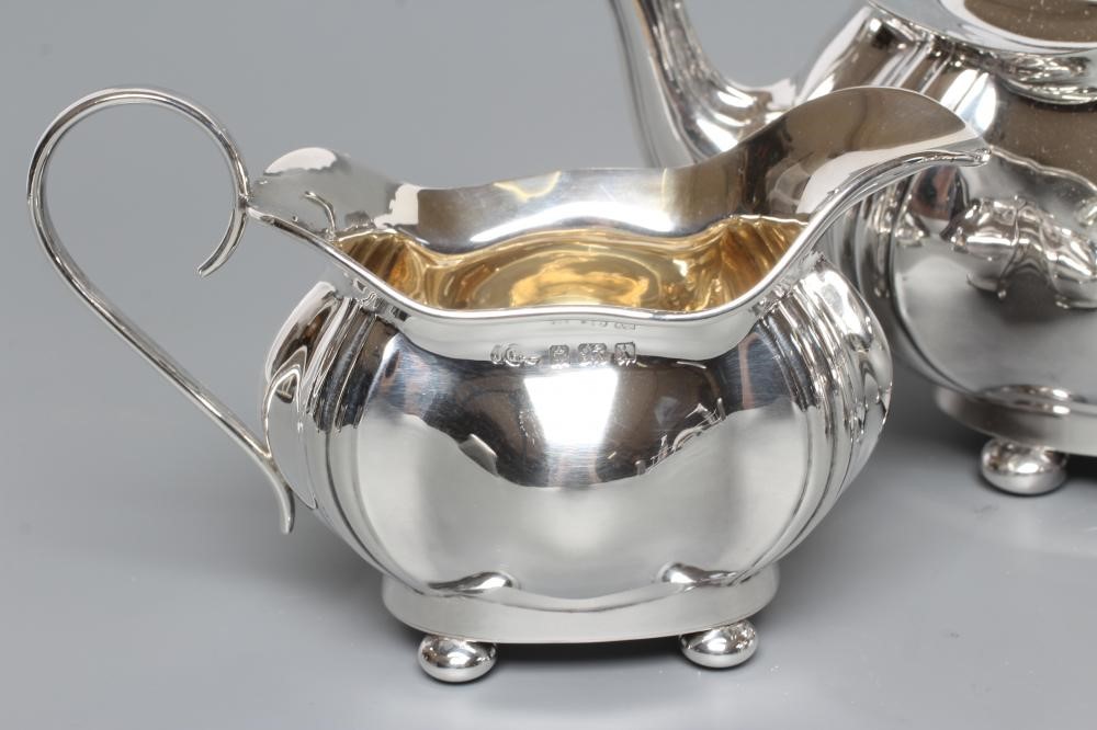 A SILVER THREE PIECE TEA SERVICE Image
