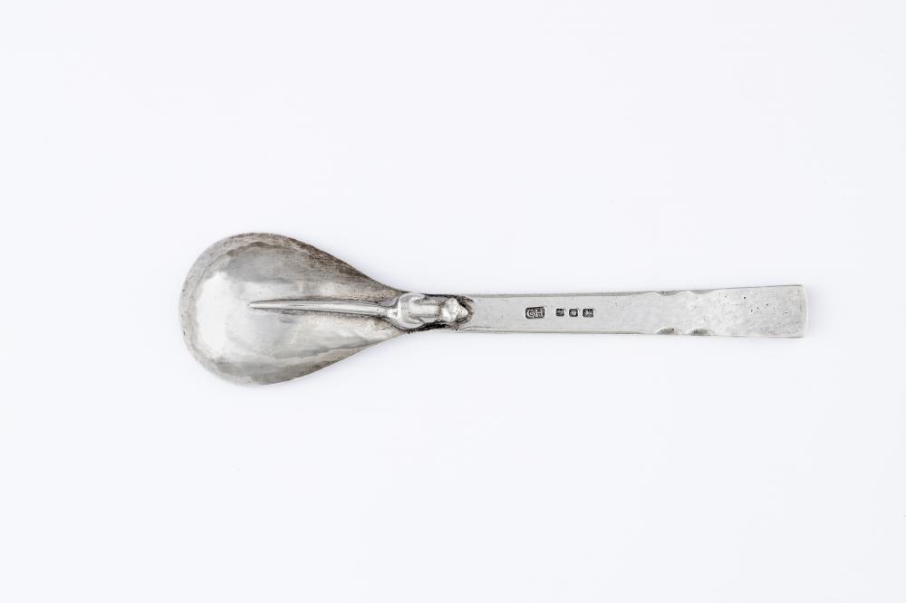 AN ARTS AND CRAFTS SILVER PRESERVE SPOON Image