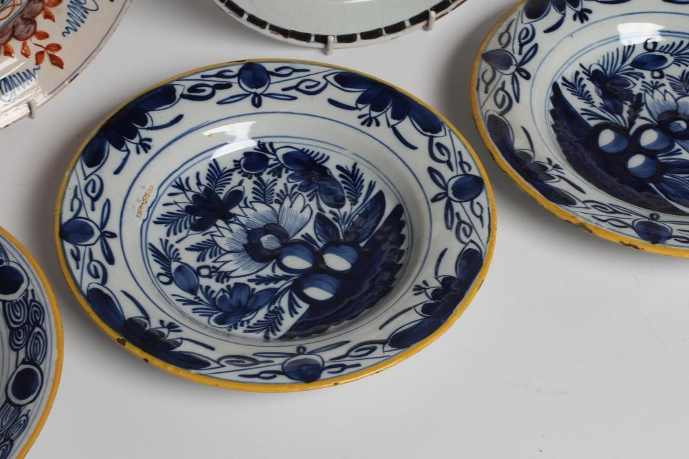 A DUTCH DELFT DISH of plain circular form painted in polychrome enamels with a parrot perched upon a Image