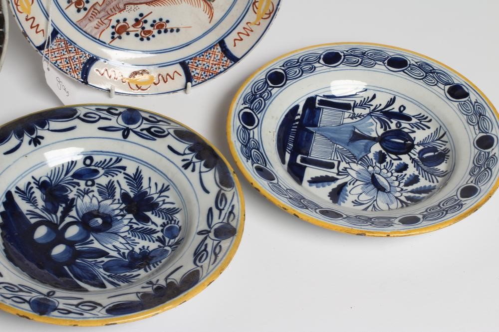 A DUTCH DELFT DISH of plain circular form painted in polychrome enamels with a parrot perched upon a Image