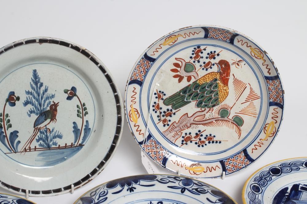A DUTCH DELFT DISH of plain circular form painted in polychrome enamels with a parrot perched upon a Image