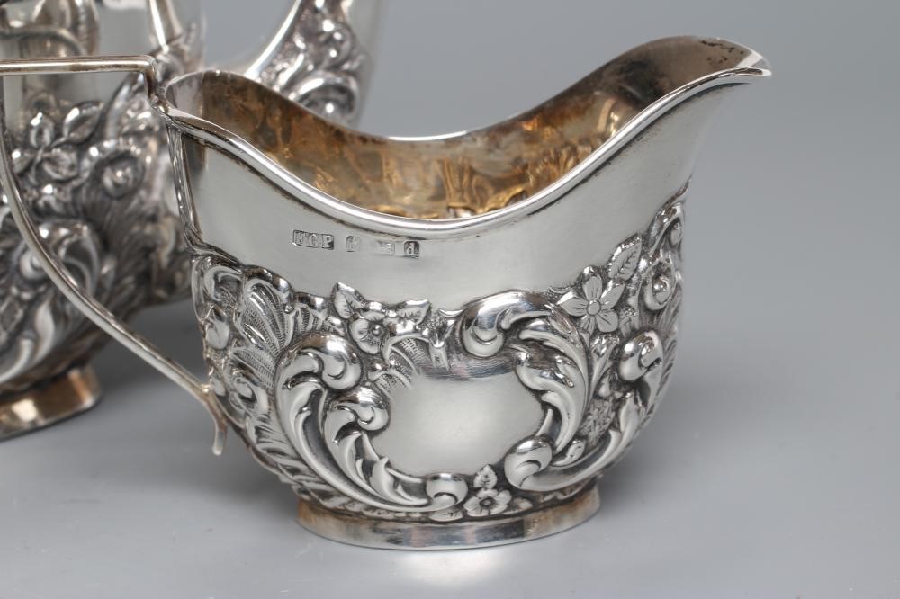 A BACHELOR'S EDWARDIAN SILVER COMPOSITE THREE PIECE TEA SERVICE Image