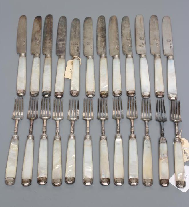 A SET OF TWELVE PAIRS OF FRUIT KNIVES AND FORKS Image