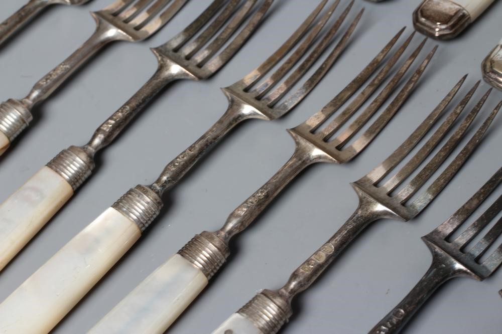 A SET OF TWELVE PAIRS OF FRUIT KNIVES AND FORKS Image
