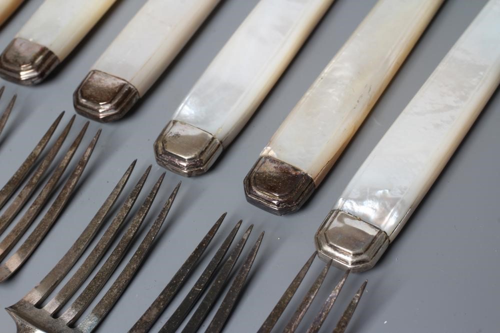 A SET OF TWELVE PAIRS OF FRUIT KNIVES AND FORKS Image